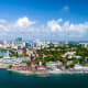 Aerial view of Dar es Salaam city skyline with waterfront, beaches, and harbor in Tanzania
